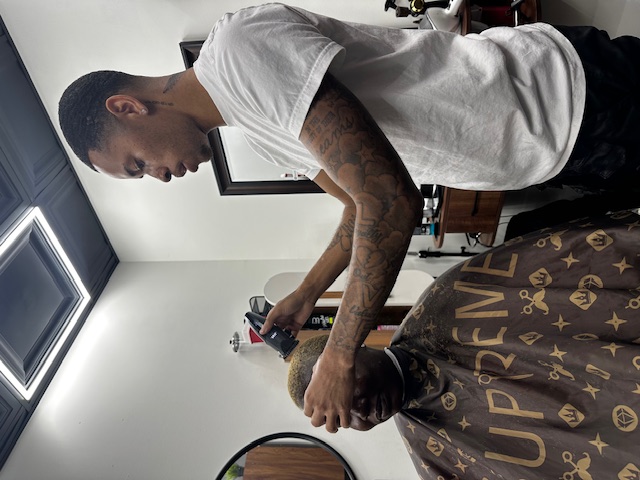 Barber with supreme cape